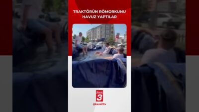 Bursa’da sıcak havalardan bunalan bir grup genç, traktörün römorkunu suyla