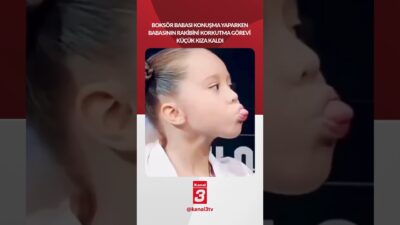 Boksör olan babası konuşma yaparken babasının rakibini korkutma görevi küçük