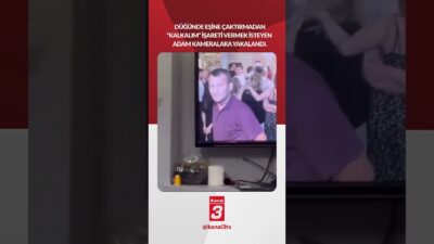 Düğünde eşine çaktırmadan “Kalkalım” işareti vermek isteyen adam kameralara yakalandı!