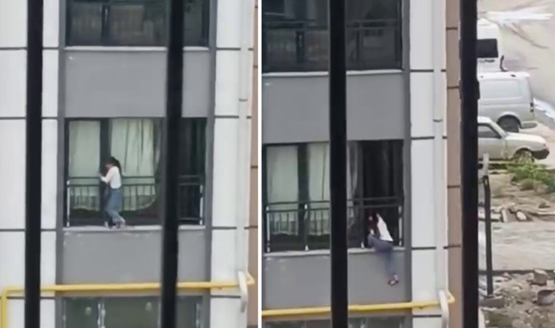 Hatay'ın Antakya ilçesinde bir apartmanın birinci katındaki pencereden dışarı çıkan