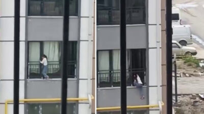 Hatay'ın Antakya ilçesinde bir apartmanın birinci katındaki pencereden dışarı çıkan