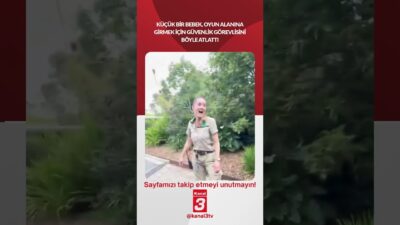 Küçük bir bebek, oyun alanına girmek için güvenlik görevlisini böyle